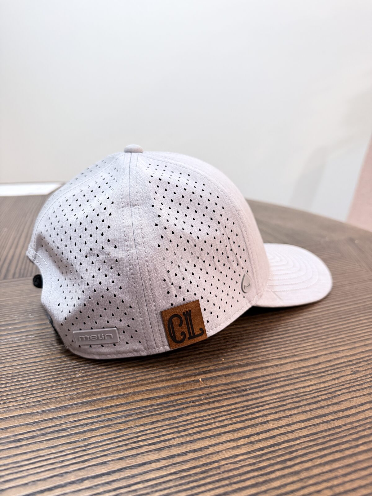 Finished custom cap with a heat-pressed leather patch at an Event Hat Bar
